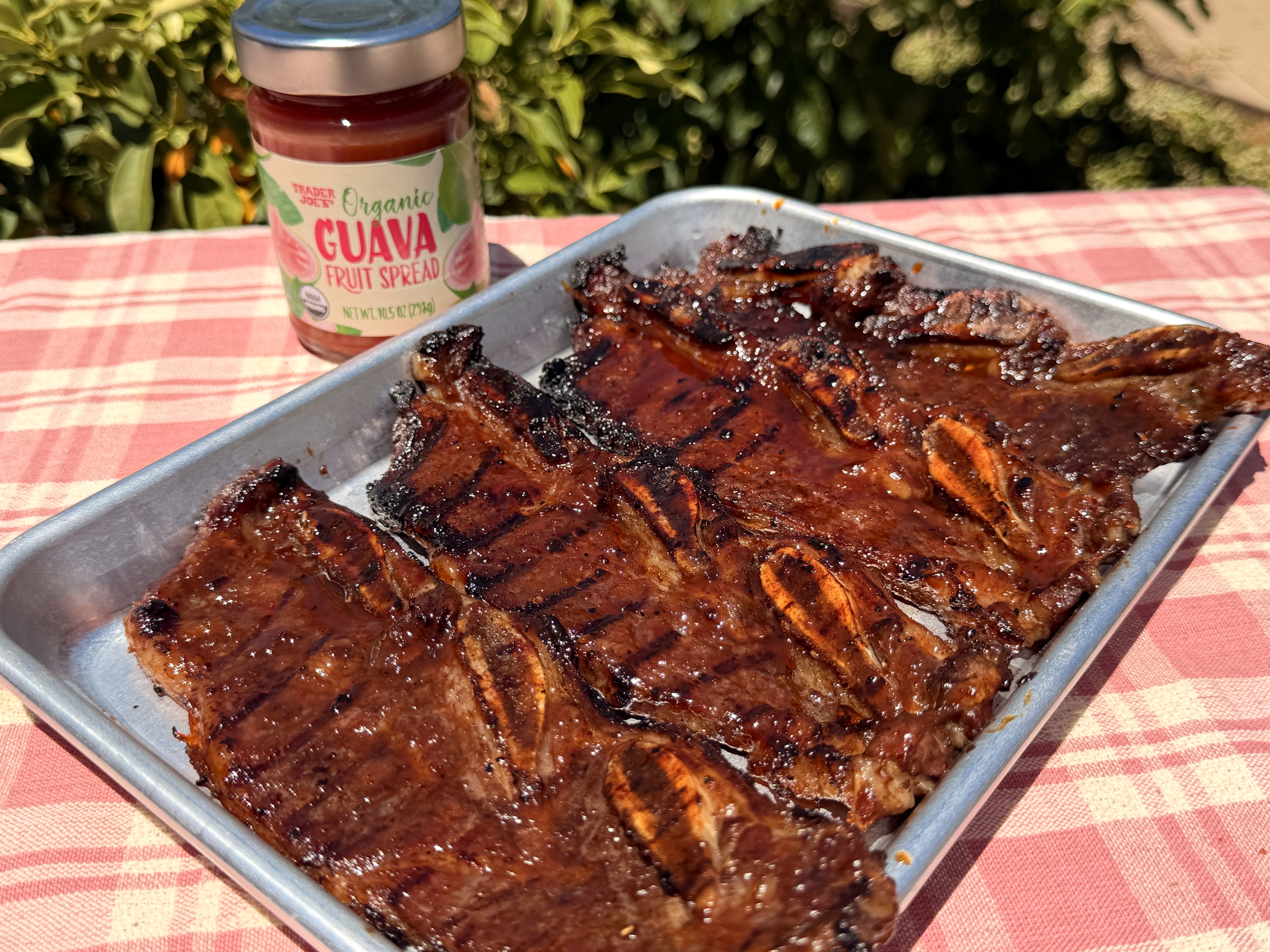 Short ribs marinating in guava jam, soy sauce, garlic, and sliced onion