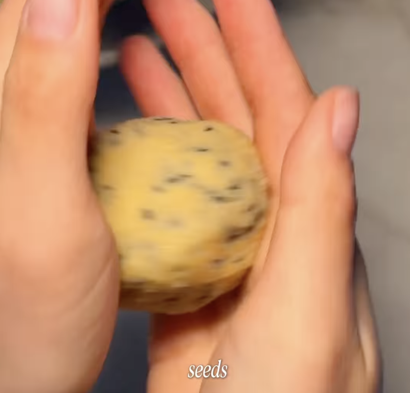 rolling cookie dough into a ball